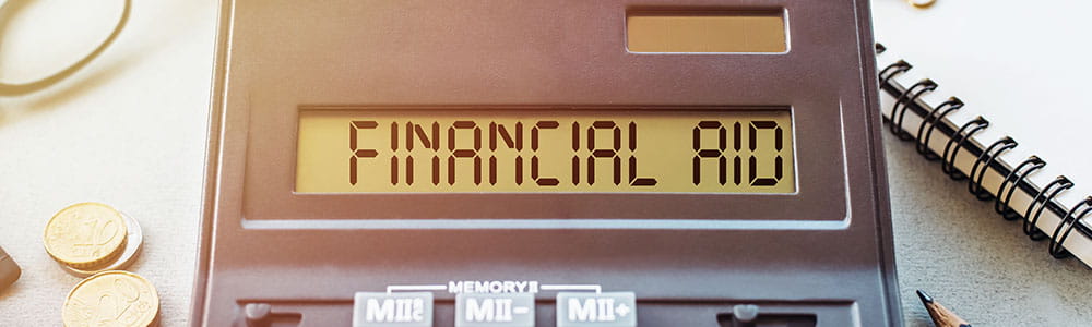 Calculator saying Financial Aid for Financial Aid Awareness Month