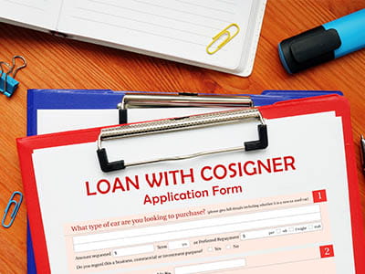Clipboard with application for a student loan with cosigner