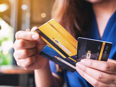 girl holding credit cards