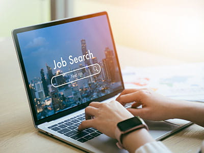 Searching for a job on a laptop