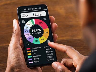 Smart phone with budgeting app being accessed 