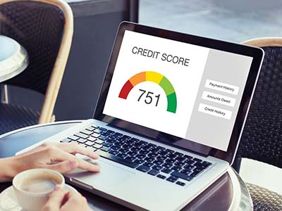 Laptop displaying a credit score of 751 which is good credit