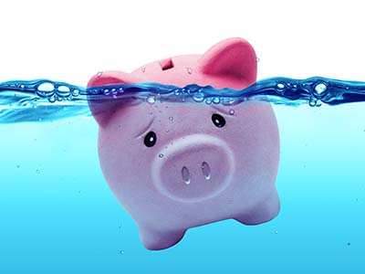 debt management - piggy bank under water to symbolize being in debt