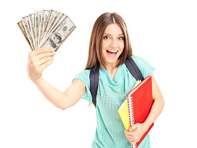 College student holding text books with one hand and cash in the other.