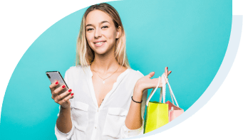 budgeting - girl holding shopping bags and smart phone