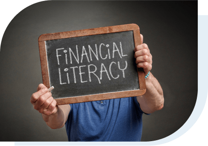 Man holding a chalkboard that says Financial Literacy