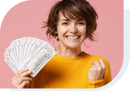 excited girl holding cash that she got to pay for college from a Private Student Loan