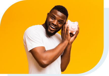 savings - man holding a piggy bank
