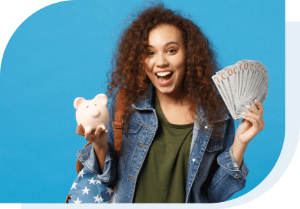 student holding a piggy bank and cash she got from a Student Loan to help pay for college